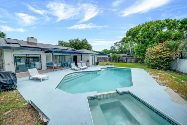 Photo 1 - Palm Harbor Pool 4BR | Hot Tub + BBQ + Game Room