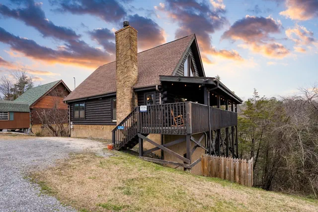 Photo 1 - Cozy Cabin Hot Tub Balcony Golf Simulator Near Pigeon Forge Smoky Mountain Group Retreat Mountains Are Calling by Avantstay
